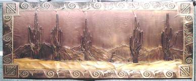 Title: "McDowell Mountains". Size: 24" X 60, framed in copper frame. Cost: $5000. This piece is copper relief, acid oxidized, mounted on wood, framed & sealed with lacquer.